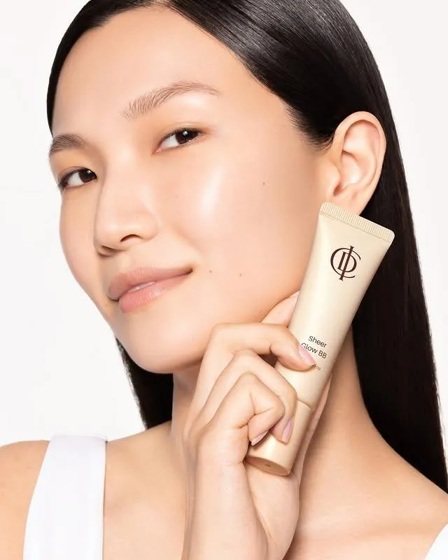 Model holding ICD Sheer Glow BB